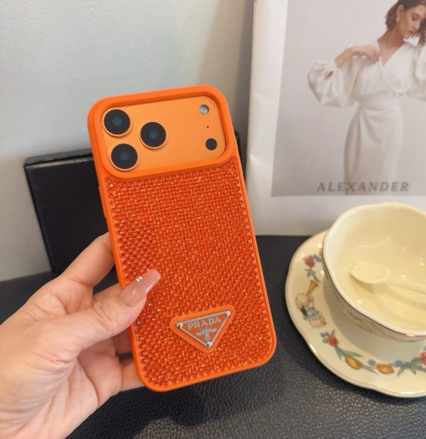 PRADA ストーン付きスマホケース ブラックホワイトオレンジ