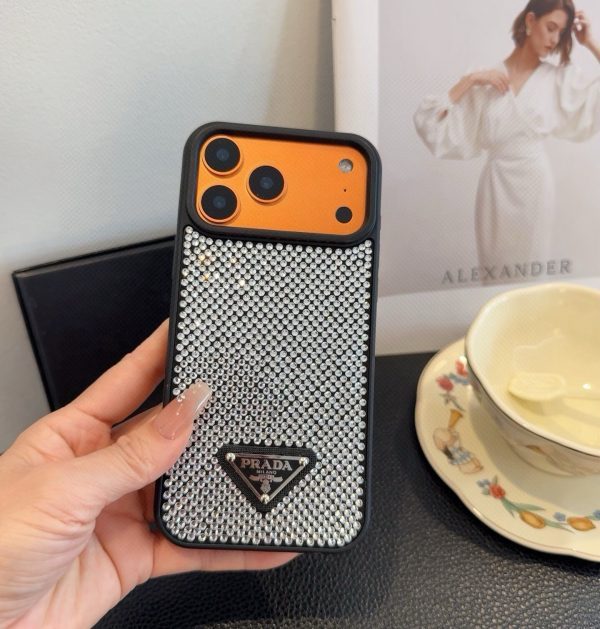 PRADA ストーン付きスマホケース ブラックホワイトオレンジ